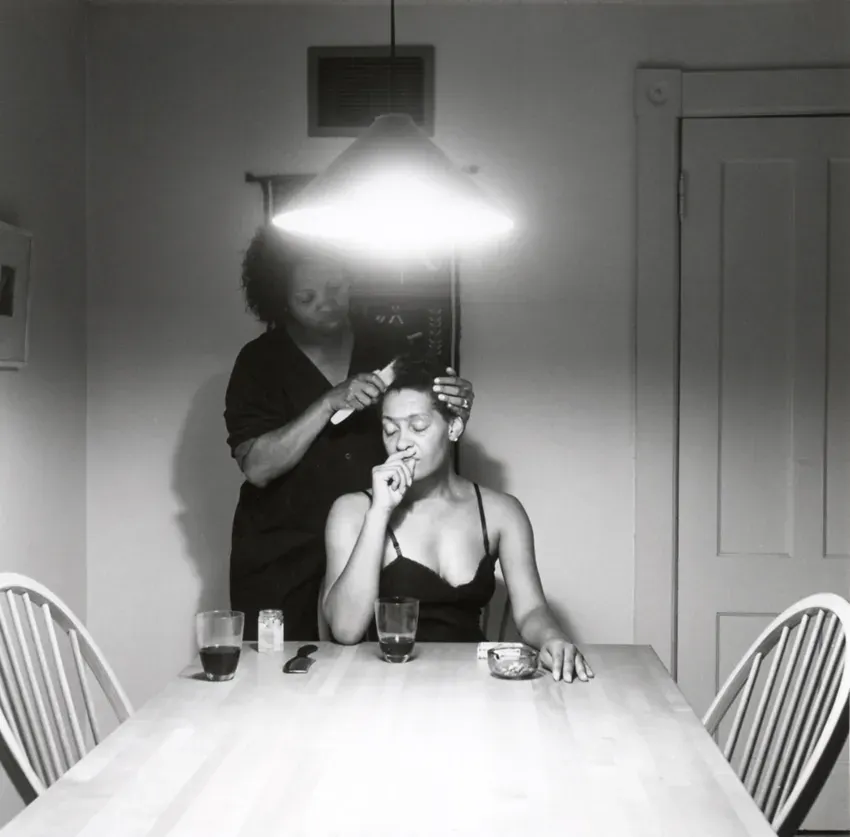 Carrie Mae Weems, Kitchen Table II: Untitled (Brushing hair)