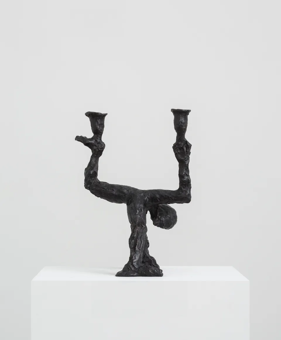 Andrew Lord, man standing, as candelabra