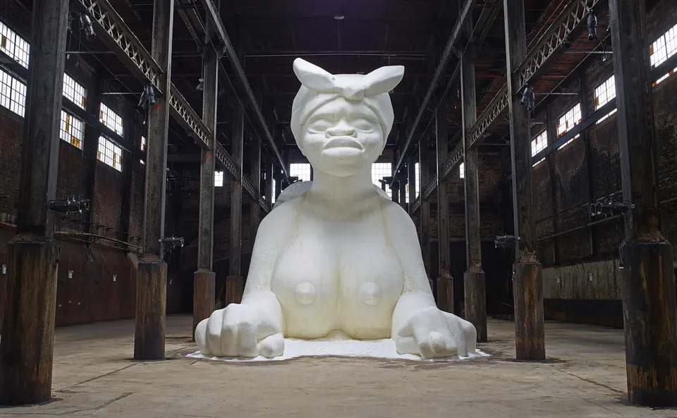 Kara Walker, A Subtlety, or the Marvelous Sugar Baby, an Homage to the unpaid and overworked Artisans who have refined our Sweet tastes from the cane fields to the Kitchens of the New World on the Occasion of the demolition of the Domino Sugar Refining Plant